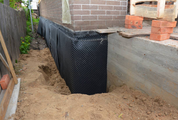 Happy homeowners after waterproofing job in Haviland